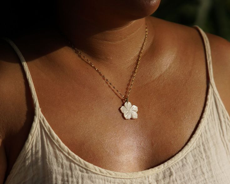 ☽ Handmade necklace with Hibiscus flower white shell pendant ☾ Material - Chain: Stainless steel Length: 42cm + 6.5cm extender 2 sizes available! These necklaces are made to order. Due to the use of natural stones and materials, every one is unique and may differ slightly than the one pictured. This item is handmade by us in Thailand, and will be dispatched within 3-5 days of purchase by tracked delivery.  We use a tracked service which normally requires a signature on delivery. You can use the White Flower Jewelry For Vacation, Summer Flower Charm Necklace As A Gift, Summer Flower Charm Necklace As Gift, Summer Flower Charm Necklace For Gift, Summer Gift Necklace With Flower Charm, Gold Beach Jewelry With Flower Charm, Summer Beach Jewelry With Flower Shape, Bohemian Summer Necklace With Flower Pendant, Summer Flower Pendant Necklace With Flower Charm