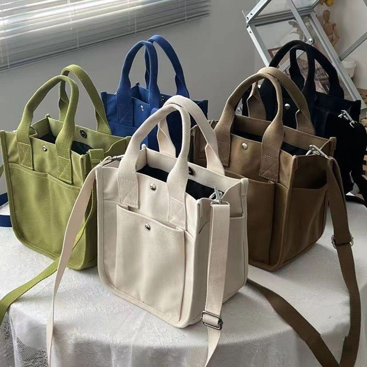 "This canvas bag/handbag tote bag/crossbody bag/birthday gift/casual bag/simple canvas bag/shoulder bag/large-capacity canvas bag，is perfect for daily. It can hold small items such as mobile phones, and cosmetics, laptop, notebooks Description Material: 100% Canvas Quantity: 1 Size : L*W *H : 9\"x5.9\"x 9.45\"( 23 x 15 x 24cm ) Colors: Multiple colors (optional) Function: handbag, shoulder bag, messenger bag If you have any questions, please feel free to contact me Thanks for visiting my store A Trendy Bags With Pockets As Gift, Casual Large Capacity Canvas Bag As Gift, Large Capacity Square Canvas Box Bag, Trendy Shoulder Bag With Pockets For Gift, Trendy Shoulder Bag With Pockets As Gift, Casual Bags With Pockets For Gifts, Casual Satchel Canvas Bag As Gift, Casual Canvas Satchel Bag Gift, Casual Shoulder Bag With Pockets As A Gift