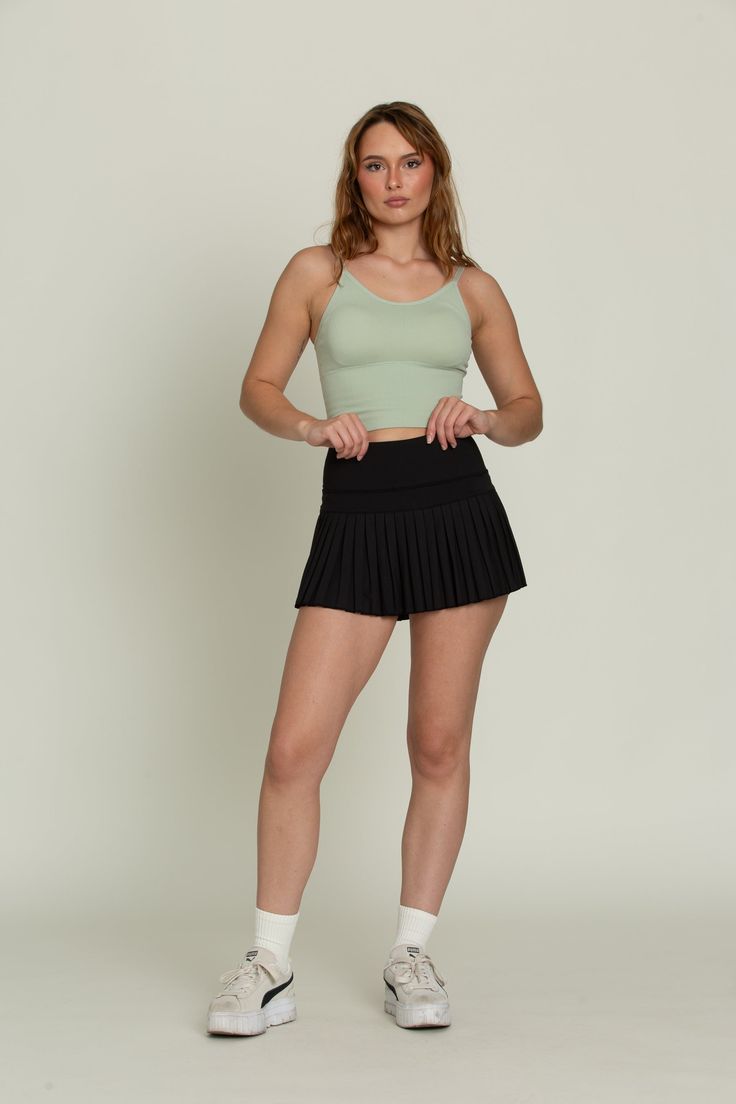 Our Black Pleated Tennis Skirt is the best everyday piece to add to your wardrobe because of its versatility & functionality. The skirt features built-in spandex shorts that include a comfortable fit and side pockets for storage. This exclusively designed Gold Hinge skirt is made of quick dry material and can take on any activity such as golf, tennis, running and more. Solid High-stretch Tennis Skirt With Built-in Shorts, High Stretch Solid Tennis Skirt With Built-in Shorts, High Stretch Tennis Skirt With Built-in Shorts, Workout Mini Skirt With Built-in Shorts, Sports Mini Skort In Elastane, Fitted Gym Skort With Pockets, Versatile Fitted Tennis Skirt With Built-in Shorts, High Waist Stretch Mini Skirt For Sports, Stretch Pleated Skirt For Workout