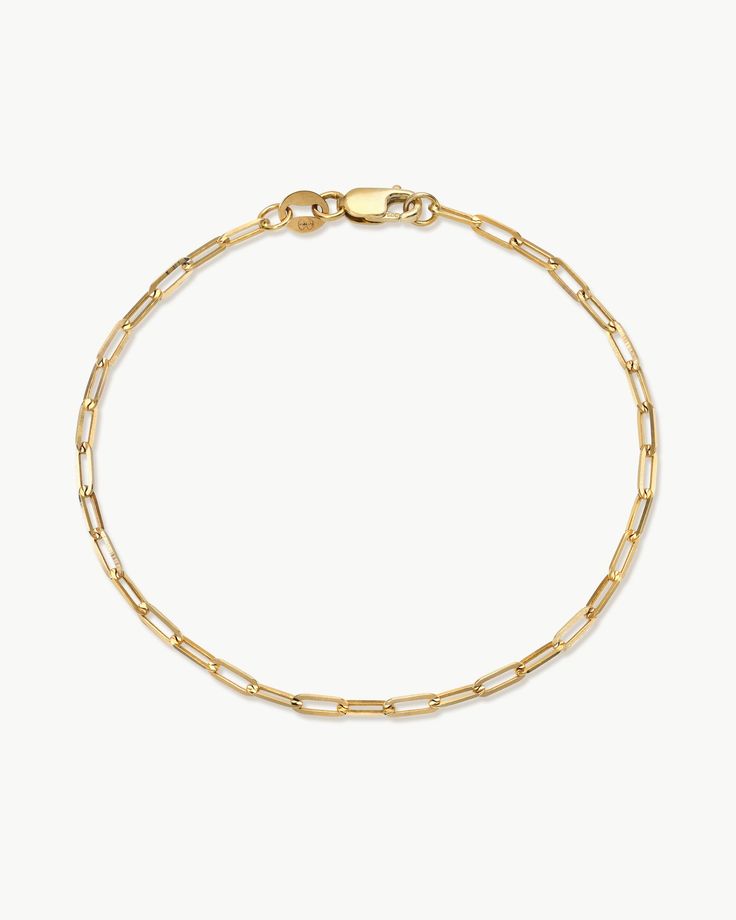 Introducing our solid 14k gold Paperclip Chain Bracelet, the ultimate modern classic. With defined edges and flat surfaces, our Paperclip chain shines from all angles when it hits the light and adds a touch of understated edge to any ensemble. Timeless Gold Link Bracelet With Polished Finish, Minimalist Jewelry With Polished Rectangular Links, Timeless Formal Chain Bracelet With Paperclip Chain, Classic White Gold Paperclip Chain Link Bracelet, Timeless Gold Bracelet With Oval Link Box Chain, Classic Tarnish Resistant Paperclip Link Bracelet, Timeless Formal Paperclip Chain Bracelet, Modern Paperclip Bracelet With Tarnish Resistant Rectangular Links, Formal Paperclip Bracelet With Polished Finish