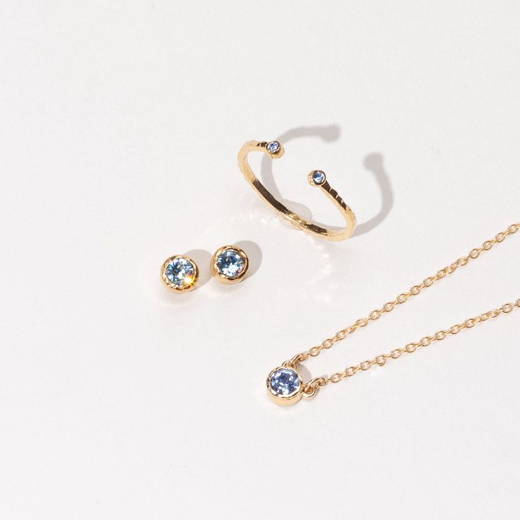 December light sapphire Birthstone Collection including a dainty gold December Birthstone Necklace Blue May Birthstone Jewelry For Gift, Blue Jewelry Gift For May Birthstone, Blue Jewelry For May Birthstone Gift, Delicate Stackable Necklaces As Gift, Delicate Stackable Necklaces For Gifts, Dainty Blue Birthstone Necklace For Everyday, Stackable Sterling Silver Necklaces For Gifts, Delicate Blue Birthstone Jewelry, Blue May Birthstone Jewelry For Anniversary