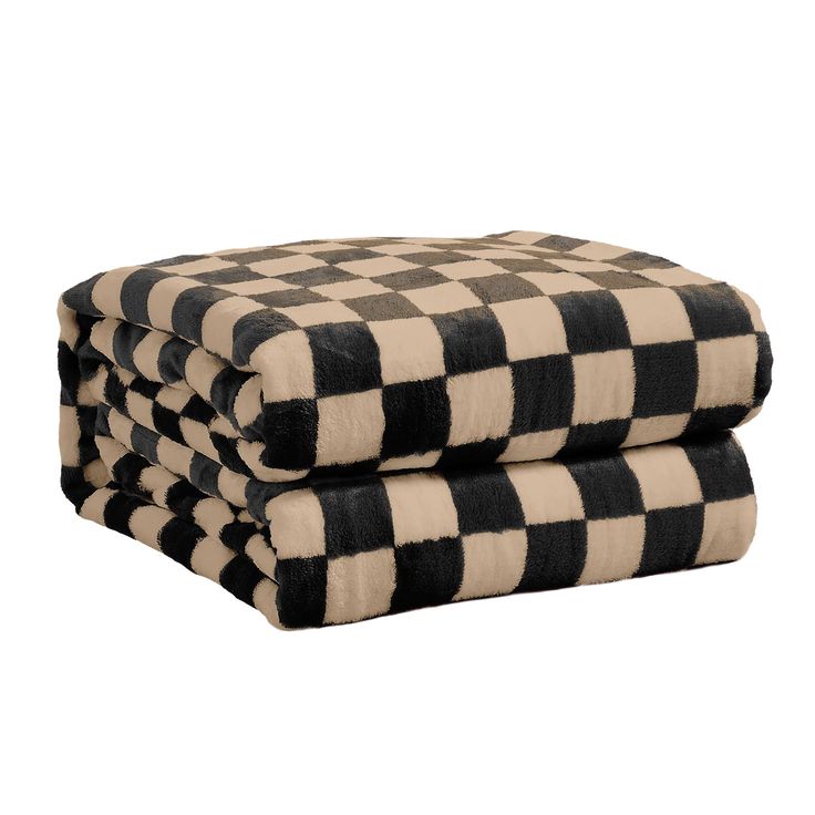 three black and white checkered towels stacked on top of each other