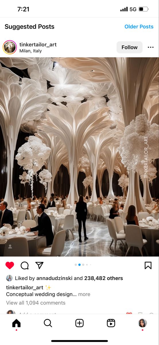 people are sitting at tables in the middle of a room with tall white trees on either side