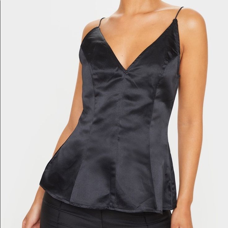 This Top Is Made With Satin Featuring A Cinched Waist And Peplum Hem. It Is Perfect To Wear For A Night Out Under A Blazer Or By Itself. Size 2 Brand New Never Worn With Tags On! Fitted V-neck Flirty Camisole, Flirty Fitted V-neck Camisole, Black Satin Cami Top, Black Satin Tank Top For Night Out, Black Satin Top For Night Out, Black Satin Cami Tank Top, Black Satin Camisole Top, Fitted Black Camisole For Party, Black Satin Camisole For Night Out