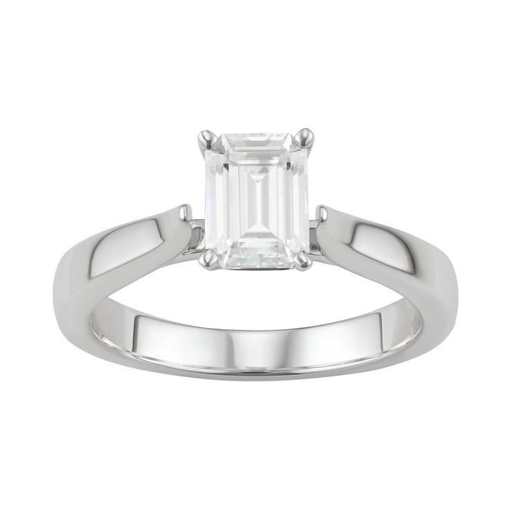 Stunning beauty is effortless with this exquisite lab-created moissanite emerald-cut solitare ring.RING DETAILS Width: 7.0 mm. Metal: rhodium-plated 14k white gold Includes: gift box & warranty card By Charles & Colvard  STONE DETAILS Stone type: lab-created moissanite Total weight diamond equivalent: 1 ct. Cut:emerald Setting: prong  Diamond equivalent carat (ct.) Total Weight (T.W.) represents the approximate total weight of diamonds of equivalent appearance.Please note, due to the hig Timeless Moissanite Emerald Ring With Brilliant Cut, Classic Diamond White Emerald Ring With Brilliant Cut, Timeless White Emerald Ring With Brilliant Cut, Formal Solitaire Emerald Moissanite Ring, Classic Radiant Cut Emerald Ring In Platinum, White Emerald Ring With Platinum Center Stone, Platinum Emerald Ring With Center Stone In White, Classic Round Cut Moissanite Emerald Ring, White Emerald Platinum Ring With Center Stone