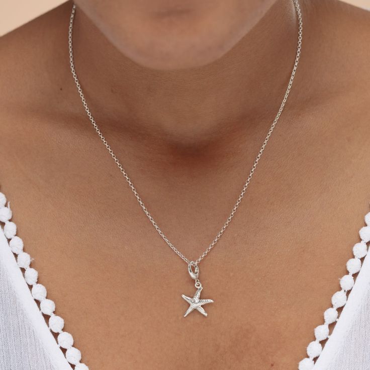 The ideal accessory to add beach vibes to your outfit! This hand finished silver starfish charm necklace has beautiful detailing, and will be an instant favourite with all stylish beach lovers out there. A symbol of love, guidance and good luck, this 3D starfish necklace looks great worn alone or layered with additional necklaces for a stunning ocean-inspired pendant.   All our charms attach with a clip-on clasp and are compatible with all other leading charm jewellery brands. Simply clip-on or Starfish Charm Necklace For Beach, Star Charm Necklace For Summer, Silver Beach Charm Necklaces For Summer, Silver Charm Necklace For Beach, Silver Summer Beach Charm Necklaces, Silver Charm Necklaces For Summer Beach, Silver Charm Necklaces For Beach, Summer Beach Silver Charm Necklaces, Summer Star Charm Necklace As Gift