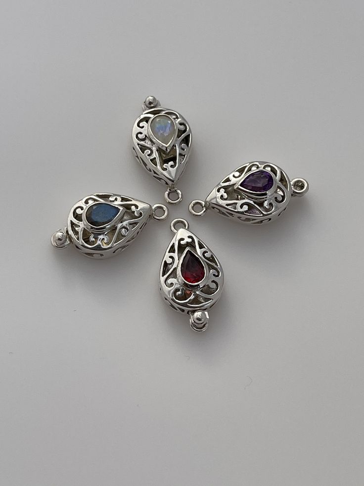 This Listing Is for one Pcs Of Sterling Silver Gemstone Clasp Size 14mmX27mm Gemstones: Garnet (1Pcs) Labradorite (1Pcs ) Amethyst (1Pcs) Moonstone (1Pcs) Blue Topaz (1Pcs) Highly polished 925 sterling silver clasps with Natural and best quality gemstones with a lot of fire. Sterling Silver Teardrop Charms Jewelry, Sterling Silver Teardrop Pendant Jewelry With Stones, Sterling Silver Teardrop Pendant With Stones, Sterling Silver Jewelry With Gemstone Beads, Sterling Silver Sapphire Gemstone Beads Jewelry, Silver Teardrop Pendant Jewelry With Stones, Silver Teardrop Gemstones For Anniversary, Sterling Silver Teardrop Stones Jewelry, Sterling Silver Teardrop Jewelry