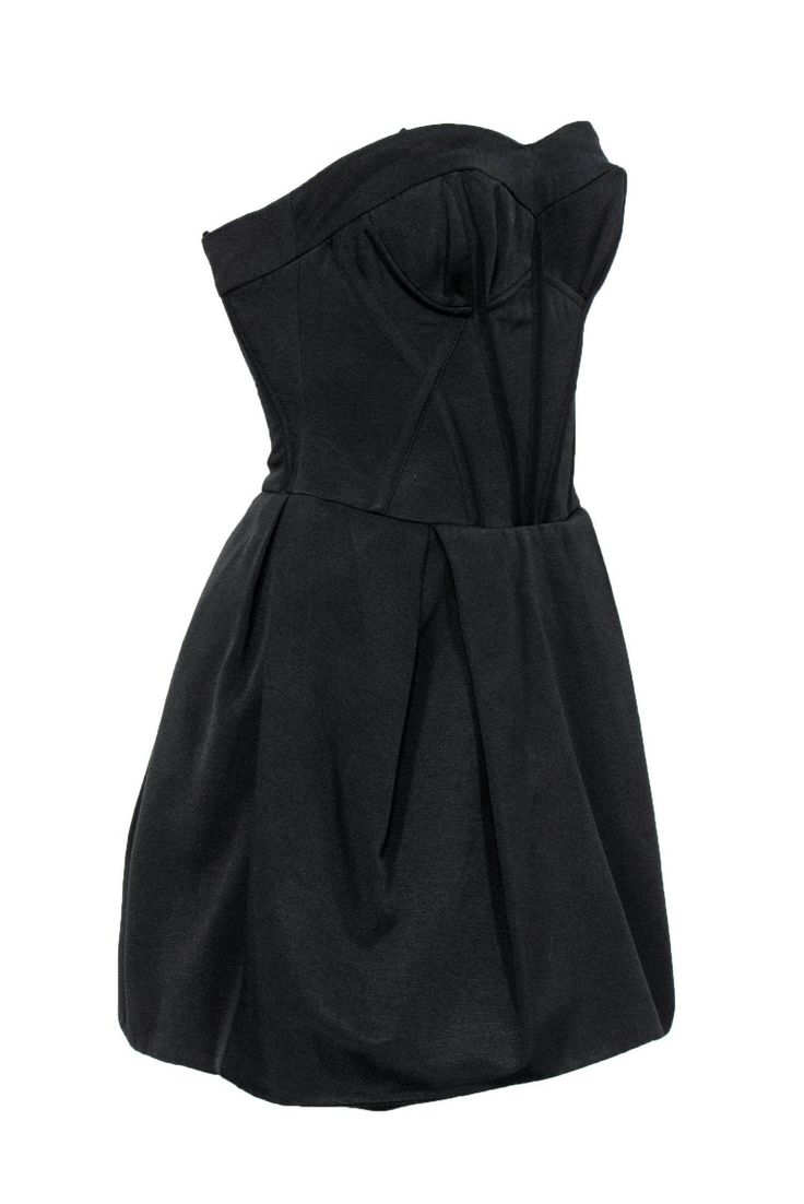 Go for a sultry look on your next night out with this dress from Jill Stuart! A corset-style bodice adds edge to this sexy frock. Pair with sky high stilettos and a chic clutch and you'll be sure to turn heads! Size 2 Shell: 63% Cotton, 37% Polyester Lining: 100% Acetate Exposed back zipper Lined Sweetheart neckline Sleeveless, strapless Open pockets on sides of waist Corset-style bodice Pleated skirt Bust 29" Waist 27" Total length 25" Strapless Ruched Bodice Corset For Night Out, Black Strapless Dress With Boned Bodice For Date Night, Sleeveless Party Dress With Bust Darts, Sweetheart Neckline Mini Dress With Flattering Silhouette For Cocktail, Chic Fitted Corset Dress For Night Out, Strapless Overbust Dress With Lined Bodice For Party, Night Out Corset Dress With Pleated Fitted Bodice, Chic Strapless Dress With Boned Bodice For Evening, Chic Strapless Dress With Pleated Bodice For Night Out