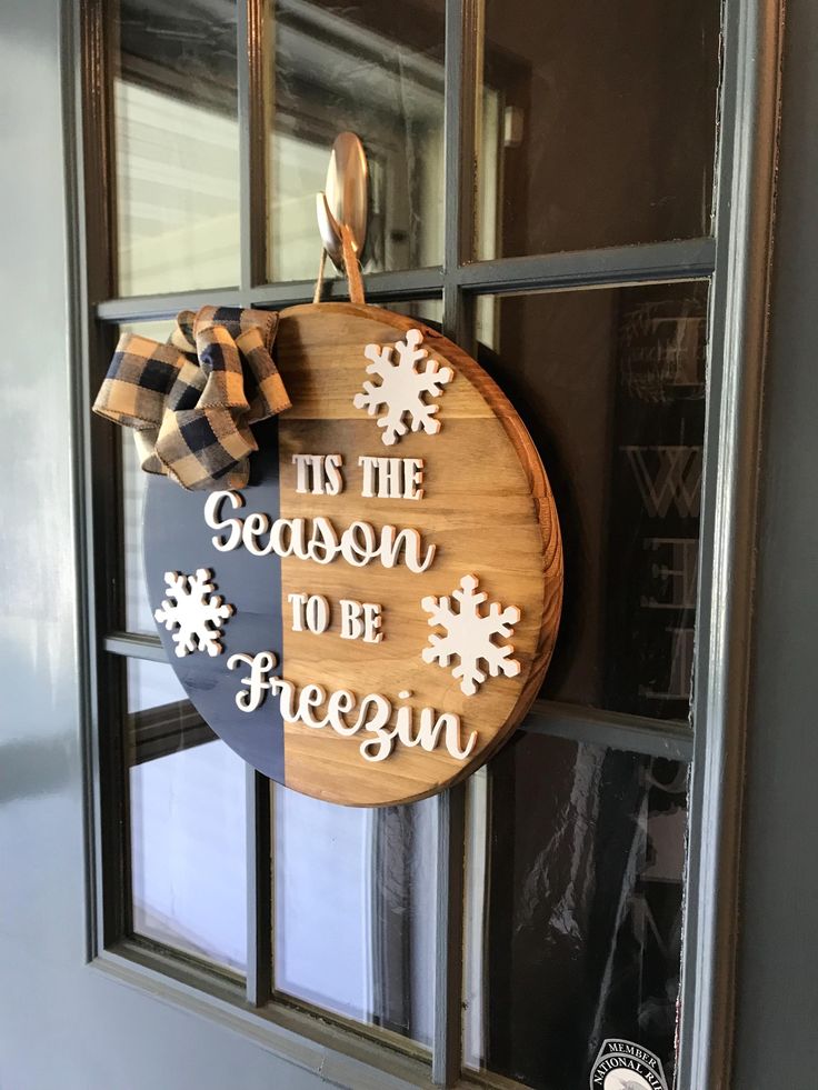 a wooden sign that says tis the season to be freegung hanging on a door