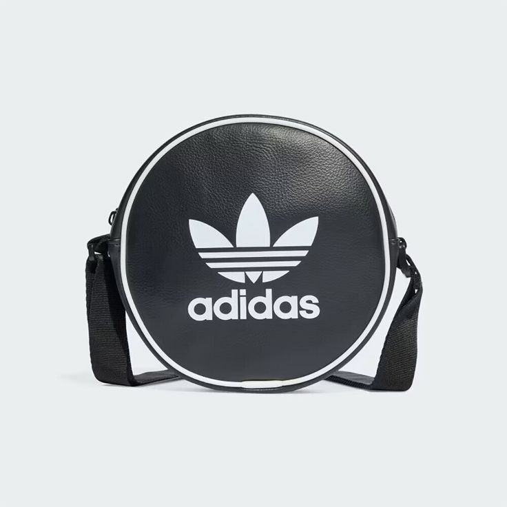 HIGH QUALITY Lorem ipsum dolor sit amet consectetur. FAST SHIPPING Lorem ipsum dolor sit amet consectetur. LOW PRICES Lorem ipsum dolor sit amet consectetur.   New Adidas Original ADICOLOR CLASSIC ROUND BAG BLACK / WHITE IT7592 TAKSE ADICOLOR CLASSIC ROUND BAG IT7592 BLACK / WHITE Features: •Condition : New •Materials: Polyurethane •Size: W 6.7"(17cm) x H 6.7"(17cm) x  D 2"(5cm) Convenient and stylish shoulder bags with a vintage vibe From the streets to the festival, this adidas classic bag is versatile enough to take you wherever you need to go. The zippered main compartment holds your most-used items, while the front pouch keeps smaller items secure. The strap length can be adjusted to your liking for a comfortable fit. The combination of sturdy yet lightweight materials and a retro vib Running Clothes Women, Bold Shoes, Adidas Adicolor, Adidas Bags, Adidas Classic, Adidas Original, Stylish Shoulder Bag, Round Bag, Classic Bags