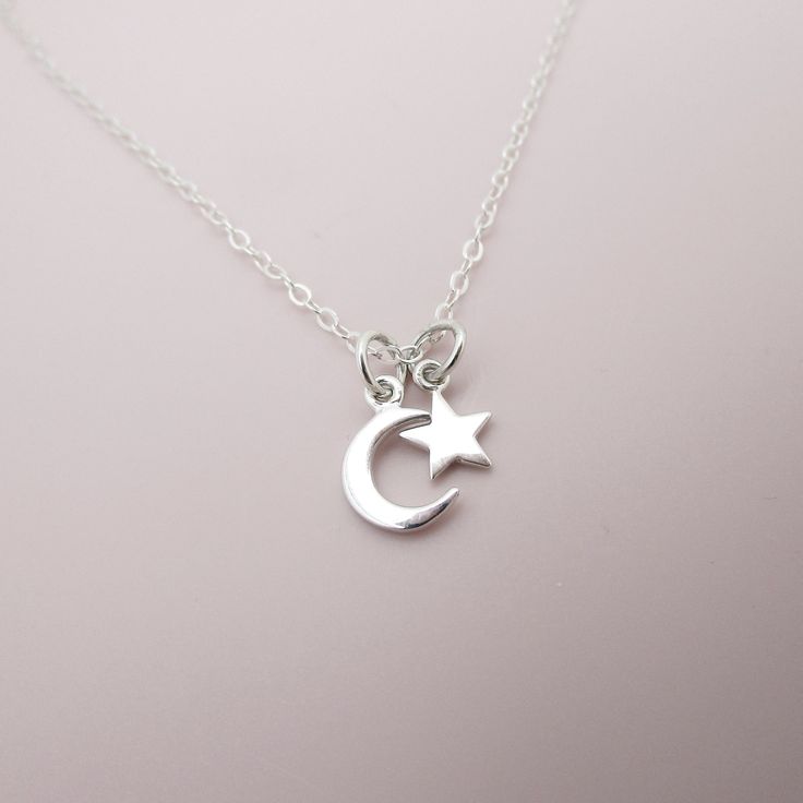 ALL STERLING SILVER - A GREAT KEEPSAKE This celestial necklace is lovingly hand-made with all solid sterling silver parts, making it a thoughtful gift (even for yourself!). A tiny moon and star dangles elegantly from the sparkly chain. Closes with an easy-to-use spring clasp. Moon charm measures approximately 3/8 inch tall and the star 1/4 inch tall. Comes in a gift box, perfect for gift-giving.  **SIZING - PLEASE READ: Select your necklace size at checkout. Note that necklaces will fit differen Moon Phase Star Charm Necklaces As Gift, Sterling Silver Celestial Pendant Charm Necklace, Silver Necklace With Moon Charm And Star Shape, Silver Celestial Charm Necklace For Everyday, Silver Celestial Charm Necklaces For Everyday, Everyday Celestial Sterling Silver Charm Necklaces, Sterling Silver Star And Moon Charm Necklaces, Sterling Silver Charm Necklace With Moon And Star, Sterling Silver Star Charm Necklace With Moon Charm