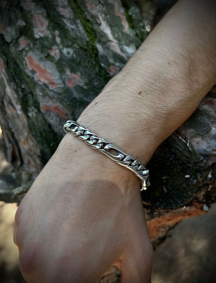 Featuring a unique cut-out design. This eye-catching bracelet combines traditional craftsmanship with modern flair, making it a perfect accessory for any occasion. ✦Item Details ➥ Material: 925K Sterling Silver ➥ Chain Length For Bracelet Use: (Select Variation) -7 Inch (18 Cm) -8 Inch (20 Cm) -9 Inch (23 Cm) ➥Please Contact me for specific lengths or add a note ➥ Weight: 44 Grams (In Average) ➥ Ready to Ship in 1-2 Business Days In Usual ✈✈Free UPS Express Shipping (2-4 Business Days) ✈✈ ♻️Recycled Eco-Friendly Quality Packaging♻️ ♻️DerGrünePunkt Registered Eco-Friendly Business♻️ ★★30% OFF WHEN YOU BUY 2 ITEMS★★ ★★40% OFF WHEN YOU BUY 3 ITEMS★★ ----------------------------------------------------------- Silver, a currency used for millennia, maintains its value, while craftsmanship, incr Silver Figaro Chain Bracelet As Gift, Modern Figaro Chain Bracelet As Gift, Adjustable Silver Bracelet With Figaro Chain, Adjustable Silver Figaro Chain Bracelet, Modern Engraved Link Chain Bracelet, Modern Silver Bracelet With Figaro Chain, Bracelet For Men, Cut Out Design, Sterling Silver Chain