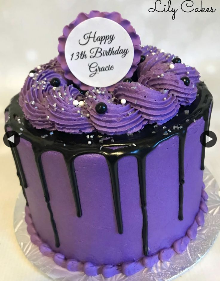 a birthday cake with purple frosting and black icing on the top that says happy 13th birthday grace