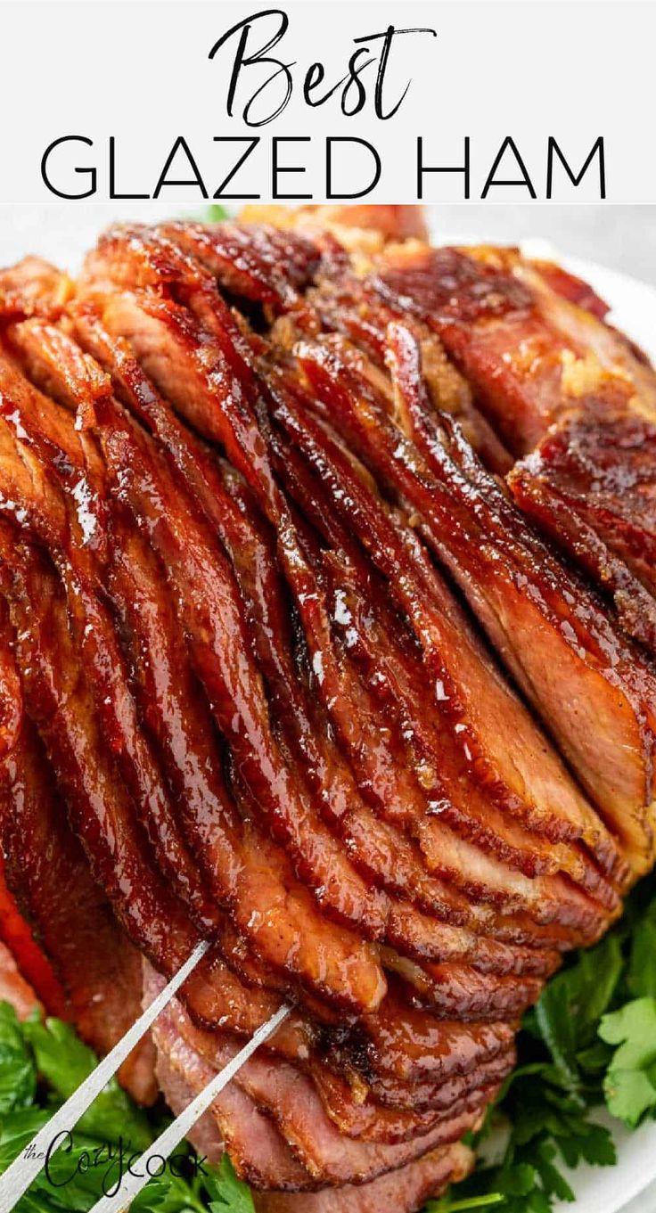 a large piece of meat sitting on top of a white plate with chopsticks