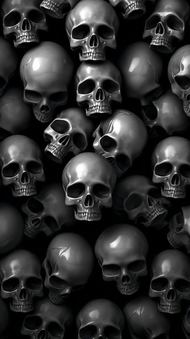 a bunch of skulls that are all black and white