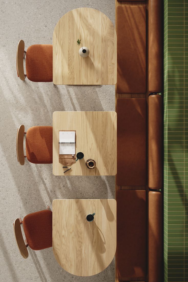 an overhead view of two wooden tables with chairs