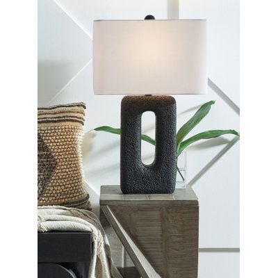 a lamp that is on top of a table