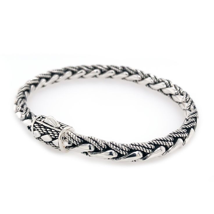 Wrap your wrist in this highly-polished 925 sterling silver bracelet and make a strong statement of your classic everyday ensemble. This unique Hybrid bracelet features two-different weaves, an intricate design clasp, and a push-button closure for a secure fit. This delicate bracelet is perfect for daily wear and instantly elevates a casual or a dressy outfit. Sterling Silver Handcrafted 5mm. Push Button Clasp Unisex Styling Classic Adjustable Bracelet With Intricate Design, Classic Adjustable Sterling Silver Bracelet With Intricate Design, Classic Sterling Silver Braided Bracelet With Engraving, Classic Engraved Sterling Silver Braided Bracelet, Elegant Engraved Braided Bangle Bracelet, Adjustable Luxury Bracelets With Intricate Design, Luxury Adjustable Bracelets With Intricate Design, Classic Bangle Chain Bracelet With Sterling Silver Clasp, Classic Braided Bracelet With Sterling Silver Clasp For Gift