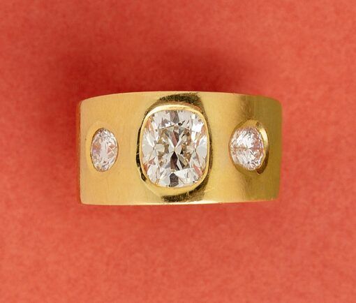 a ring with three diamonds on it