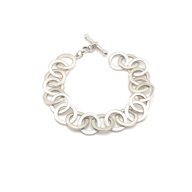 I am so happy to have come across a beautiful example of Canadian modern jewelry! This silver bracelet features a toggle closure and circle chain links. The piece is in excellent estate condition, showing minimal wear. Thank you so much and happy shopping! Modern Sterling Silver Bracelets With Toggle Clasp, Modern Sterling Silver Clasp Chain Bracelet For Everyday, Everyday Metal Chain Bracelet With Sterling Silver Clasp, Modern Sterling Silver Bracelet With Toggle Clasp Gift, Silver Jewelry With Jump Ring For Everyday, Silver Sterling Chain Bracelet With Toggle Clasp, Everyday Chain Bracelet With Sterling Silver Clasp, Modern Chain Bracelet With Toggle Clasp For Everyday, Silver Minimalist Metal Toggle Necklace