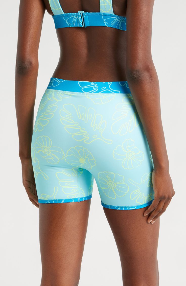 A reversible design doubles your styling opportunities in these effortless swim shorts made with built-in sun protection and a stretchy, stay-put fit. Elastic waist UPF 50+ sun protection 80% recycled polyester, 20% spandex Machine wash, tumble dry Imported Green Athleisure Shorts For Poolside, Swimwear With Built-in Shorts And Short Inseam, Stretch Swim Trunks With Short Inseam, Short Swimwear With Uv Protection For Swimming, Stretch Swimwear With Elastic Waistband For Surfing, Stretch Swimwear For Surfing In Short Length, Sporty Swimwear With Elastic Waistband For Surfing, Short Swimwear For Surfing In Warm Weather, Green Activewear Shorts For Swimming