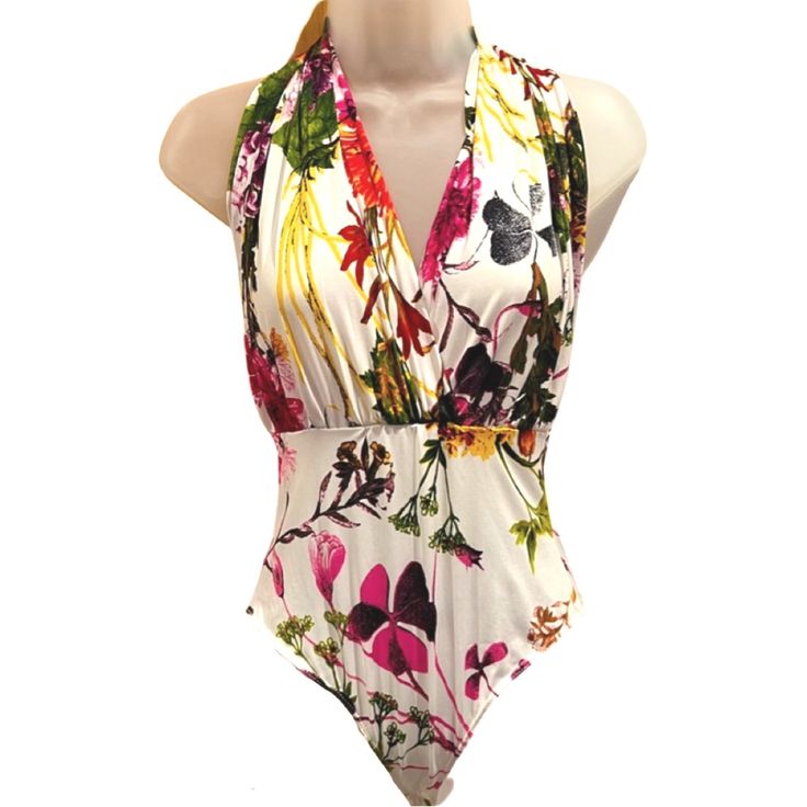 Glamazon Halter Bodysuit Floral White Size Medium Preowned: Never Worn Multicolor Fitted V-neck Swimwear, Fitted Bodysuit For Spring And Summer, Fitted Floral Print Summer Bodysuit, Sleeveless Summer Bodysuit With Floral Print, Summer Sleeveless Floral Bodysuit, Summer Floral Print Sleeveless Bodysuit, Fitted V-neck Floral Print Bodysuit, Chic Stretch Swimwear With Floral Print, Summer Floral Print Stretch Bodysuit