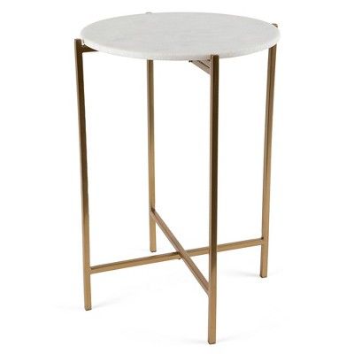 a white marble top side table with gold metal legs and a round shaped design on the bottom