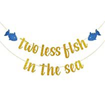 two less fish in the sea banner with gold foil letters and blue fishes on it