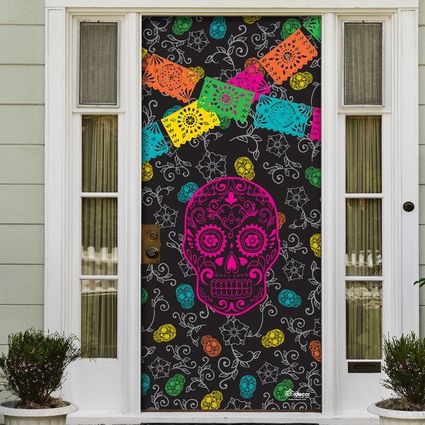 a decorated front door with a colorful sugar skull on it