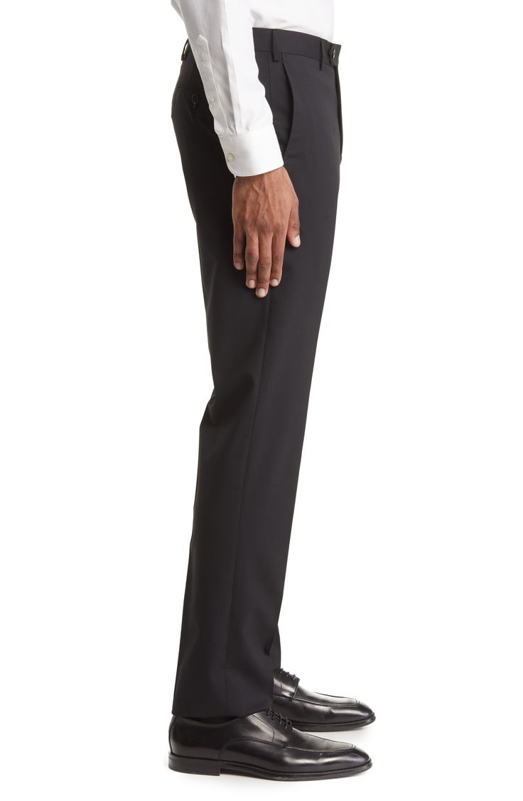 Polished Italian wool with a touch of stretch smartly finishes a pair of trousers tailored with a flat front and signature flexible construction in the waist. 37" inseam; 15" leg opening; 10" front rise; 15 1/2" back rise (size 35) Lined to knee 98% wool, 2% elastane Dry clean Made in Italy Business Tapered Leg Elastane Pants, Black Dress Pants With Concealed Placket For Business, Black 4-way Stretch Straight Dress Pants, Black 4-way Stretch Dress Pants, Tailored Black Elastane Dress Pants, Black Tailored Elastane Dress Pants, Black Business Dress Pants With Pressed Crease, Business Black Dress Pants With Pressed Crease, Modern Stretch Business Bottoms