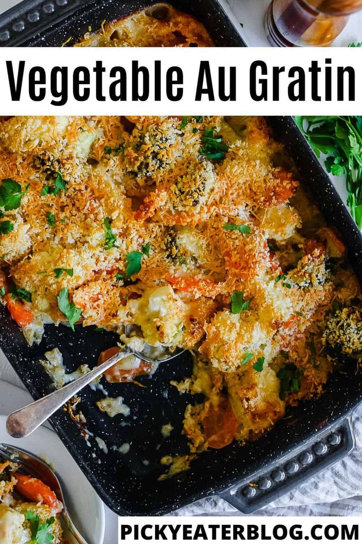 a casserole dish with vegetables and grated cheese in it on a table