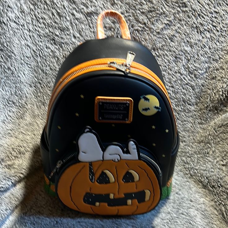 Peanuts Halloween Pumpkin Mini Backpack Halloween Themed Travel Backpack, Themed Halloween Travel Backpack, Themed Backpack For Everyday Use And Halloween, Cute Halloween Travel Backpack, Themed Black Backpack For Everyday Use, Black Standard Backpack For Halloween, Black Halloween Standard Backpack, Cute Black Bags For Halloween, Black Backpack For Halloween