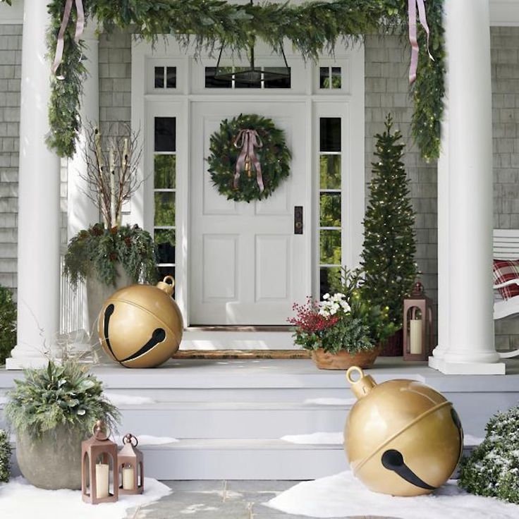 christmas decorations on the front steps of a house