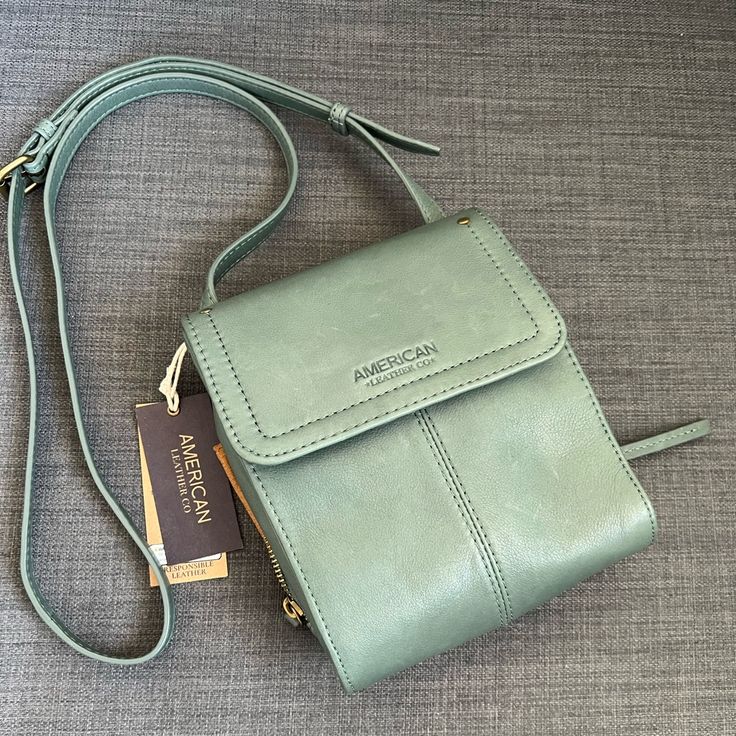 Brand New With Tag Crossbody Bag Shoulder Purse Soft Pebbled Genuine Leather Sage Leaf Smooth Color Old Brass Hardware Adjustable Strap 22”-26” Drop Two Compartments: One Has Flap Magnetic Closure & Zipper Pocket Zipper Compartment On The Back One Phone Slip Pocket Four Credit Card Slips Approximately 6.25”L 7.5”H 2"- 3"W Durable Useful Bag! Pet & Smoke Free Home Please See My Entire Collection Flap Bag With Cell Phone Pocket For On-the-go, On-the-go Flap Bag With Cell Phone Pocket, Travel Mobile Phone Bag, Chic Flap Bag With Cell Phone Pocket For Travel, Chic Travel Flap Bag With Cell Phone Pocket, Chic Flap Bag With Cell Phone Pocket, Satchel With Cell Phone Pocket For Daily Use, Travel Shoulder Bag With Mobile Phone Pocket, Leather Crossbody Flap Bag With Cell Phone Pocket