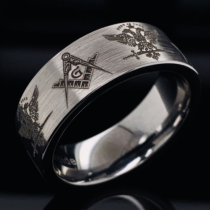 Celebrate his accomplishments with this stunning 33 Degree Masons Two Headed Eagle Tungsten Wedding Ring, Like the square and compasses symbol, the double-headed eagle motif is one of 33º Scottish Rite Freemasonry's most recognizable symbols. Stunning and detailed this Masonic Tungsten Ring is durable and fashionable. The inside shank is rounded for Comfort fit. If you like the design, but prefer the ring in Silver, Yellow gold or Rose gold color, please contact me to check the size and availabi Symbolic Engraved Wedding Ring, Symbolic Wedding Engraved Ring, Wedding Rings Stainless Steel Round Band, Wedding Stainless Steel Ring With Round Band, Wedding Stainless Steel Round Band Rings, Symbolic White Gold Rings For Formal Occasions, Formal Stainless Steel Round Band Ring, Formal Symbolic White Gold Rings, Symbolic Engraved Wedding Ring With Engraving Option