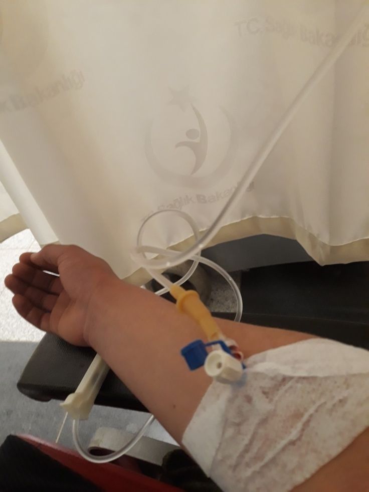 a person with an iv attached to their arm