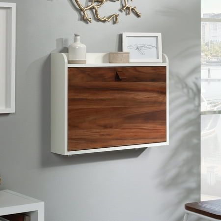 a white and wood cabinet in a room