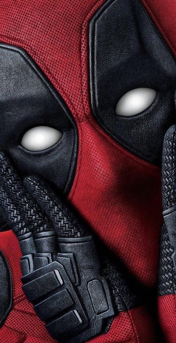 a close up of a deadpool mask and gloves