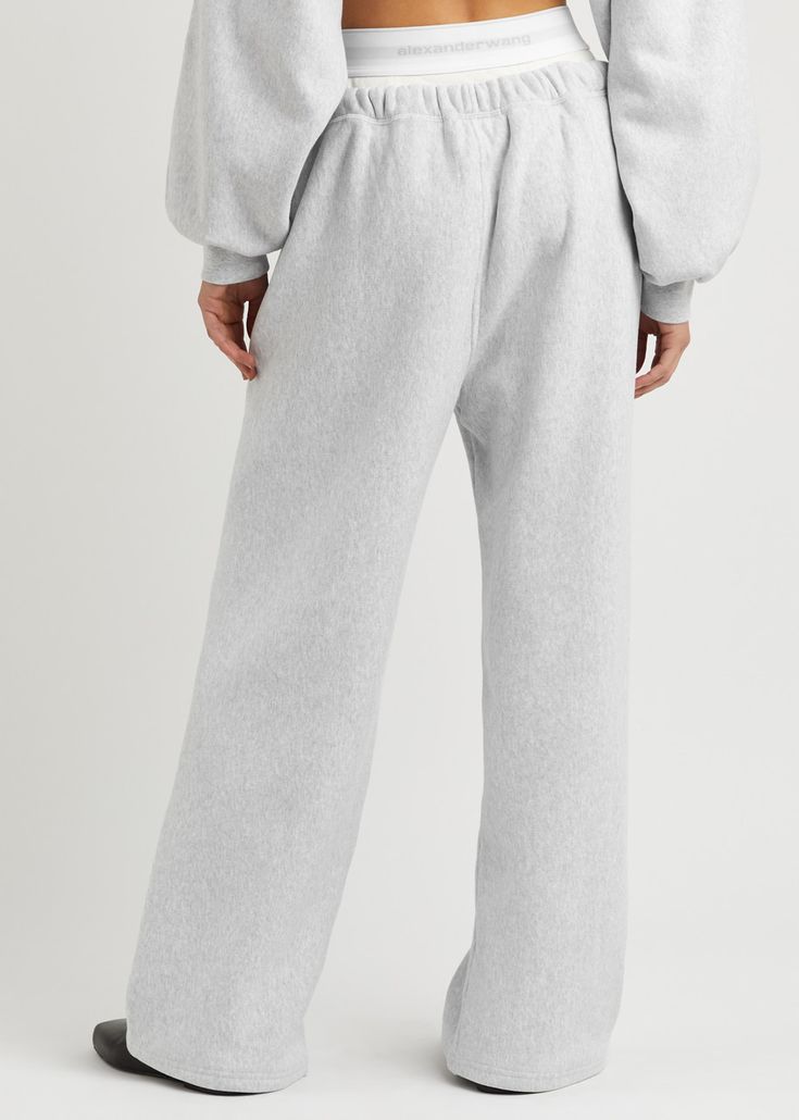 Find ALEXANDER WANG Logo Layered Cotton Sweatpants on Editorialist. Info & Care alexanderwang.t cotton sweatpants Logo-jacquard ribbed boxer-effect underlay at drawstring;waist, zip-fastening side pockets Pull-on Fabric 1: 100% cotton; fabric 2: 67% cotton, 29% polyamide, 4% elastane Machine wash; Size & Fit Inside leg length: 28.5 inches/ 72.5cm Midweight Relaxed fit, slim across the high waist Model is 5'7'/ 170cm and wears a size small; Comfortable Cotton Sweatpants For Daywear, Cotton Sweats With Elastic Waistband For Fall, Relaxed Cotton Bottoms With Elastic Cuffs, Cotton Lounging Sweatpants, Cotton Tapered Leg Sweatpants For Lounging, Cotton Lounge Pants With Elastic Cuffs, Cotton Pants With Elastic Cuffs For Lounging, Athleisure Relaxed Fit Winter Bottoms, Cotton Pants With Ribbed Waistband For Loungewear