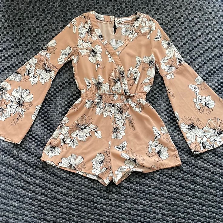 Beautiful Jumper In Great Condition - Never Worn Flower Detail And Very Comfortable Great For Summer And Spring! All Clothes Washed And Sanitized Before Shipping Summer Floral Print Long Sleeve Jumpsuits And Rompers, Long Sleeve Floral Jumpsuits And Rompers For Summer, Long Sleeve Floral Jumpsuit For Summer, Casual Floral Print V-neck Jumpsuit/romper, Casual Floral Print V-neck Jumpsuit, Spring Beige Floral Print Jumpsuits And Rompers, Beige Floral Print Jumpsuits And Rompers For Spring, Casual Floral Print Jumpsuits And Rompers For Brunch, White Floral Print Jumpsuits And Rompers For Day Out