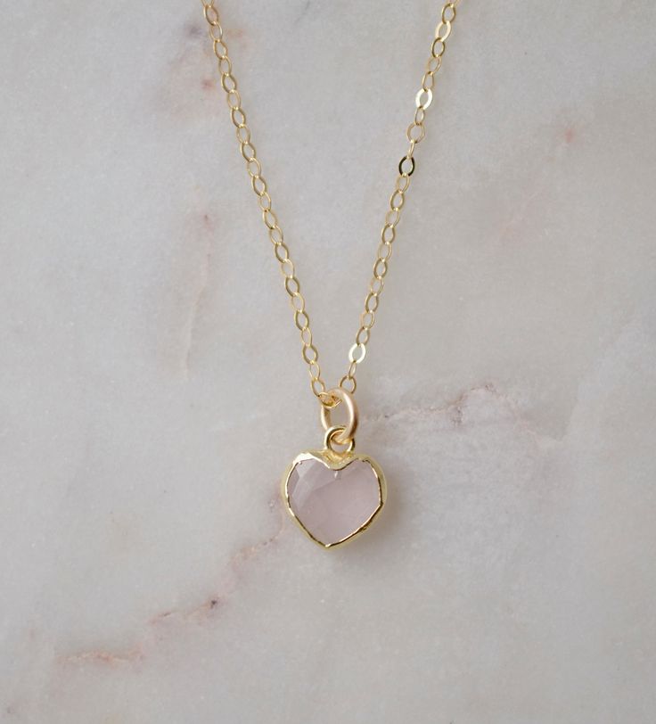 Looking for a unique accessory for some self love, or love for that special someone? Crafted from 14k gold filled and natural Rose Quartz, this pendant is the perfect, sparkling way to show anyone how much you care. Rose Quartz is a stone of love. It is believed to restore trust & harmony in relationships and encourage unconditional love. It purifies the heart and promotes self love, inner healing, and friendship. It is an alternate birthstone for January, as well as the spiritual birthstone for Handmade Rose Gold Heart Pendant Jewelry, Rose Gold Heart Pendant Necklace Gift, 14k Gold Heart Necklace With Gemstone For Gift, Dainty Pink Gold Jewelry For Everyday, Delicate Pink Gold Pendant Jewelry, Dainty Birthstone Jewelry For Valentine's Day, Rose Gold Heart Charm Jewelry With Pendant, Rose Gold Heart Charm Pendant Jewelry, Rose Gold Heart Charm Necklace In 14k Gold