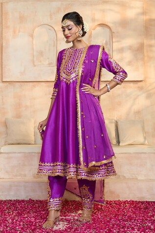 Purple anarkali in dupion base with floral pattern gota embroidered yoke, cuffs, hem and fringed lace details. Comes with matching dupion salwar and dupatta. - Aza Fashions Art Silk Kurta For Navratri Reception, Art Silk Kurta For Reception And Navratri, Traditional Drape Churidar With Gota Work For Reception, Reception Churidar With Gota Work And Traditional Drape, Traditional Churidar With Gota Work For Reception, Purple Chanderi Anarkali Set For Reception, Dola Silk Cutdana Kurta For Reception, Reception Dola Silk Kurta With Cutdana, Silk Churidar With Gota Work For Eid