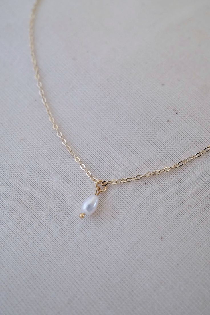 14k gold-filled dainty freshwater pearl necklace - Etsy #pearlnecklace #daintyjewelry #daintynecklace #daintypearlnecklace #necklace #necklaceoftheday #necklaceshop #necklaceoutfit #goldjewellery #goldjewelry #dainty #elegantnecklace #pearl #pearljewellery #pearljewelry #jewelryaddict #jewelrylover #jewelryforwomen #etsyshop #etsyjewelry #handmadejewelry #handmadenecklace #freshwaterpearlnecklace #aestheticnecklace #simplenecklace #goldfillednecklace #necklaceforwomen #necklaceforgirls #giftforh Teardrop Pearl Chain Jewelry Gift, Pearl Chain Teardrop Pendant Jewelry Gift, Dainty Pearl Chain Jewelry With Teardrop Pendant, Teardrop Pearl Charm Necklace In 14k Gold Filled, 14k Gold-filled Teardrop Necklace With Pearl Charm, 14k Gold Filled Teardrop Necklace With Pearl Charm, Dainty Teardrop Chain Necklace For Gift, Delicate Teardrop Pendant Jewelry For Anniversary, Delicate Teardrop Pendant For Jewelry Making