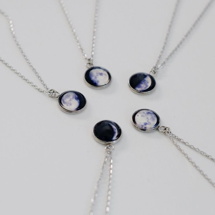 IMPORTANT NOTE: For Expected Delivery for Father's Day please order by June 9th. I recommend ordering with Priority Mail (usually 2-3 business days but can be longer). However I can only guarantee Priority Express Mail shipping will arrive in time. A custom moon phase necklace that glows in the dark. ◆ Quick Turnaround 2-5 days! ◆ Fast Shipping! ◆ Jewelry comes in a luxurious jewelry box! HOW TO ORDER Simply type your date in the personalization box. For optional Back Engraving please let me kno Adjustable Moon Phase Necklace For Gift, Blue Sun And Moon Design Necklace For Gift, Blue Sun And Moon Necklace For Gift, Moon Shaped White Necklace For Gift, Blue Necklace With Sun And Moon Design For Gift, White Moon Shaped Necklace For Gift, White Moon-shaped Necklace For Gift, Personalized Moon-shaped Jewelry Gift, Moon Print Moon Shaped Necklace Gift