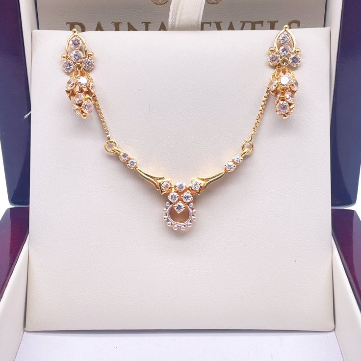 18ct Yellow Gold Beautiful Pre-Owned Cubic Zirconia Necklace & Earring Studs This timeless antique jewellery set, carefully created with attention to detail, is a useful addition to any collection. These items are sure to make an impression, whether you're attending a cultural event or just want to stand out with a unique touch. Metal: 18K Yellow Gold (750) Necklace Chain Details: Gold Weight: 9.0gm Stone Type: Cubic Zirconia Length: 17.5"inches Chain Width: 1.03mm Pendant Width x Length: 35mm x Victorian 22k Gold Hallmarked Jewelry, Victorian 22k Gold Jewelry For Formal Occasions, Ornate Diamond Jewelry With Elegant Design, Victorian 22k Gold Jewelry For Weddings, Ornate Cubic Zirconia Jewelry With Elegant Design, Gold Fine Jewelry Sets With Matching Earrings, Antique 22k Gold Jewelry For Anniversary, Yellow Gold Jewelry Sets With Matching Earrings, Ornate Gold Earrings With Diamond Accents