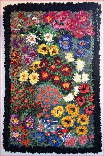 a quilt with many different flowers on it