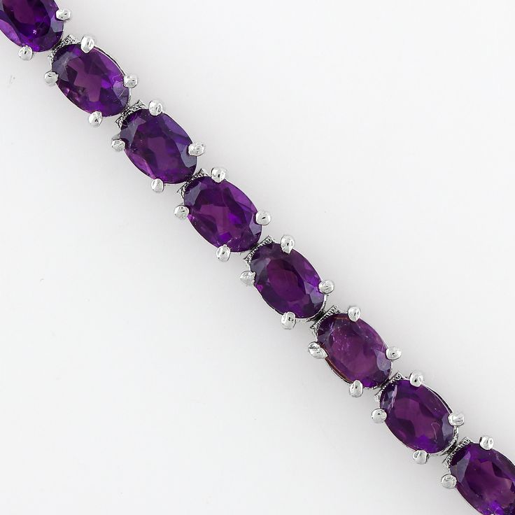 Step into the world of elegance and mystique with our Natural African Amethyst Bracelet. This exquisite piece of jewelry is more than just an accessory, it's a statement. Handcrafted with love and precision, this bracelet is a perfect gift for your wife or a treat for yourself. Key Features: Authentic African Amethyst: Sourced from the heart of Africa, the amethyst in this bracelet carries a rich history and a unique charm that sets it apart. Healing Gemstone: Known for its healing properties, t Elegant Amethyst Bracelets With Gemstone Accents, Elegant Round Purple Crystal Bracelet, Elegant Purple Round Crystal Bracelet, Elegant Purple Gemstone Bracelets, Anniversary Amethyst Gemstone Tennis Bracelet, Classic Amethyst Bracelets, Elegant Amethyst Gemstone Crystal Bracelet, Elegant Amethyst Crystal Bracelet, Formal Amethyst Round Bracelets