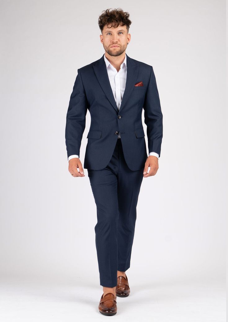 The Bryant Navy Sharkskin Suit is the perfect choice for any smart occasion. Crafted with a luxurious navy sharkskin fabric and custom made for a premium appearance, it has a deep blue color, a stylish and modern cut, and will make you look and feel confident. Navy Fitted Suit With Notch Lapel, Navy Slim Fit Suit With Notch Lapel, Navy Fitted Double Breasted Suit With Notch Lapel, Navy Double-breasted Suit With Notch Lapel, Luxury Navy Double Breasted Suit For Business, Elegant Fitted Navy Blazer, Navy Notch Lapel Tuxedo In Suiting Fabric, Navy Professional Office Suits, Modern Blue Suits With Notch Lapel