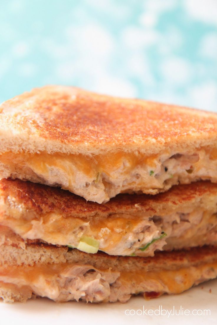 a stack of food that is on top of a white plate with blue and green background