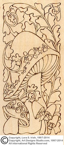 an intricately designed drawing with flowers and leaves in the center, on a piece of wood